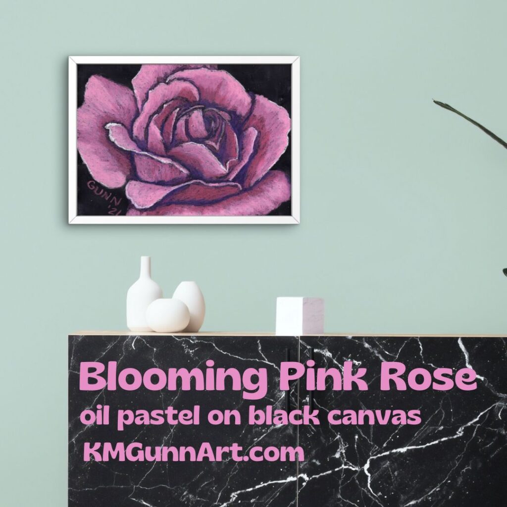 Mockup of oil pastel drawing Blooming Pink Rose in a white frame on a light green wall, which complements the vibrant pink. 